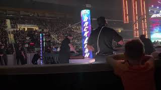 WWE production crew changing the ring canvas before the main event