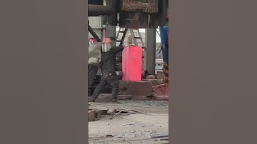 Ultra dangerous heavy-duty forging, high-temperature forging of a 1000 degree rectangular iron block