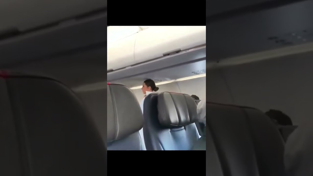 UPDATE NEW FOOTAGE Woman SEES Dark Figure On Plane And FREAKS
