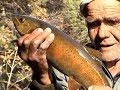 Autumn fishing in the mountains of Baikal region. Catching the Lenok on the Turokcha. Russia.