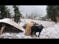Village life in snow falling in mountain region