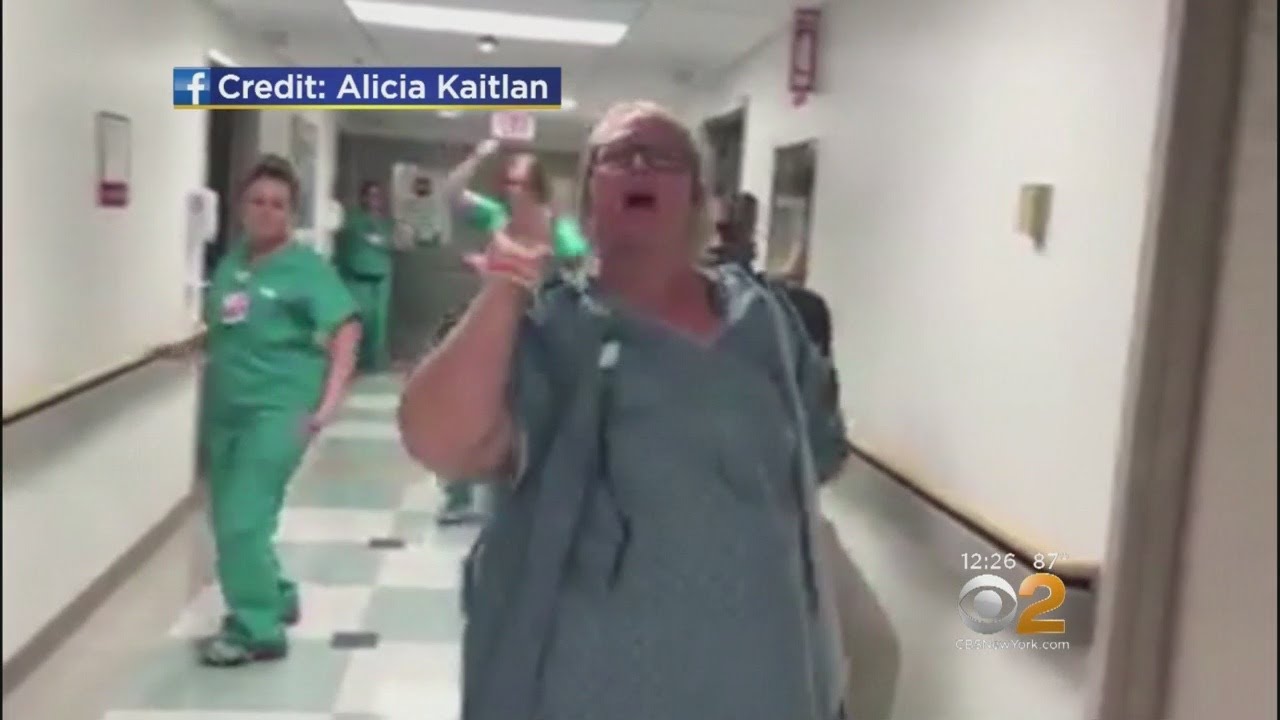 Mom Dances In Hospital Hallway During Labor