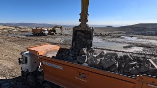 Excavator to trucks Stone loading