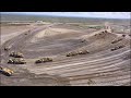 Digging new landfill cell with fleet of Caterpillar scrapers (Part 2)