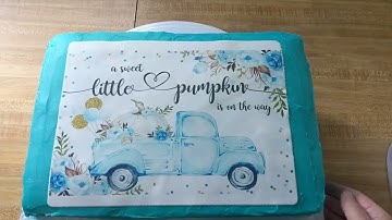 how to apply icing sheet edible image to a cake.