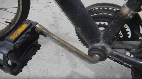 How to Take Apart a One Piece Crank Bottom Bracket on a Bicycle
