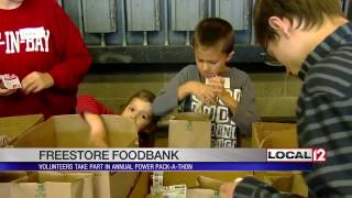 Volunteers put together Power Packs for hungry children at the Freestore