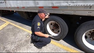Florida Highway Patrol truck tire and wheel inspection at Sneads weigh station on Interstate 10