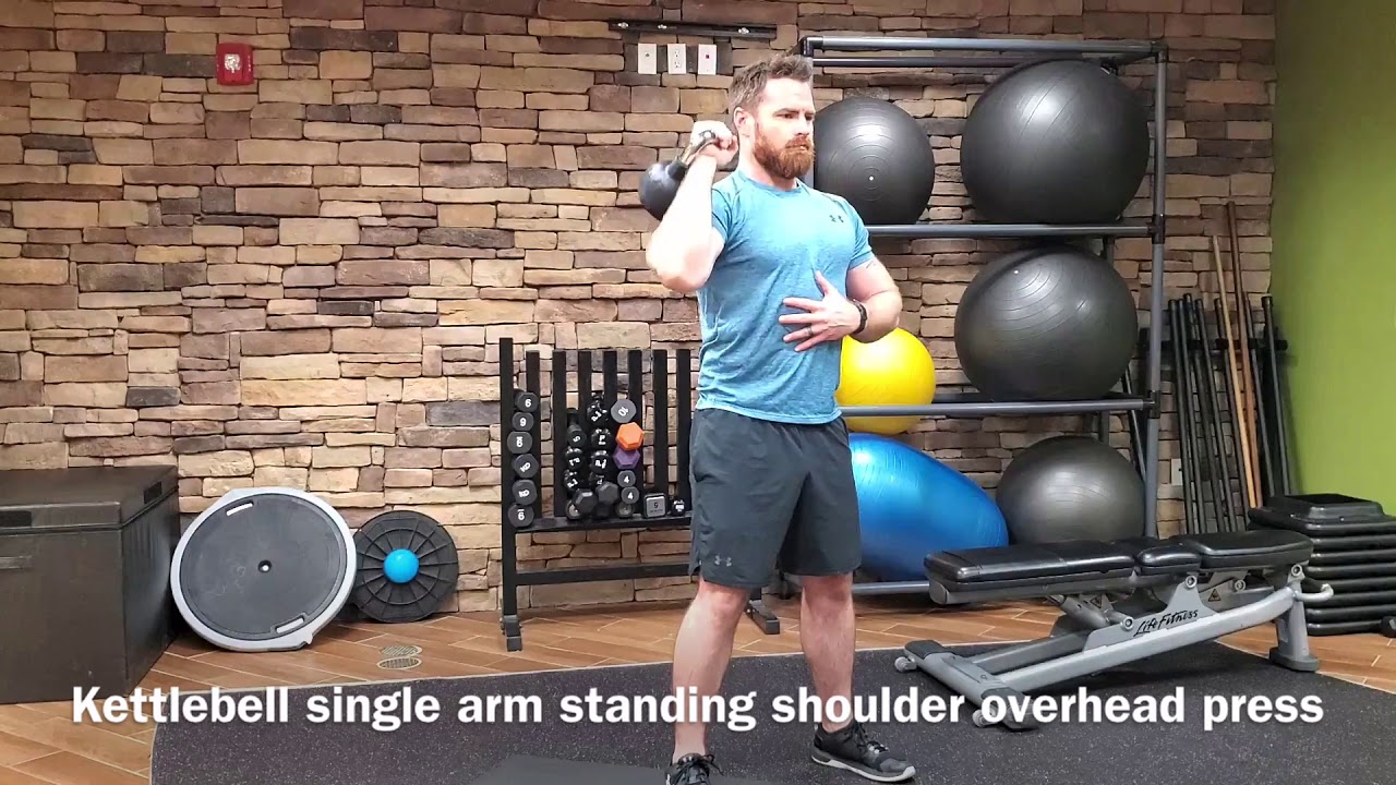 Kettlebell single arm standing shoulder overhead press - YouTube