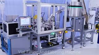 Automated vial filling, capping and labeling machine with a FANUC SR-3iA SCARA Robot