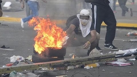 Protesters clash with riot police in Venezuela