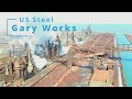Blast furnaces breathing steam and smoke on a cold day at the us steel gary works facility