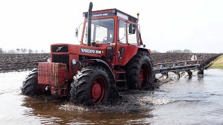 Vintage Tractors Plowing in The Lake