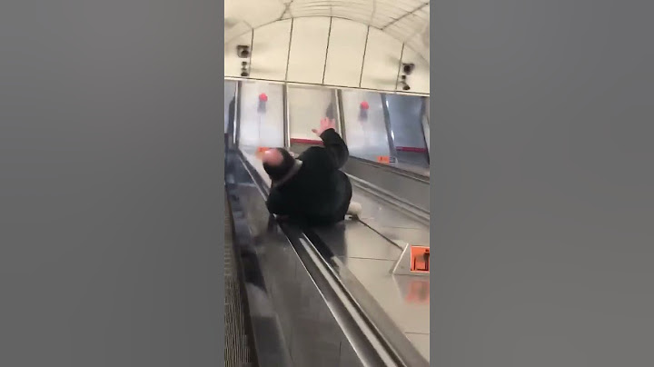 Man Falls Hilariously While Attempting Challenge of Sliding Down Escalator - 1650045