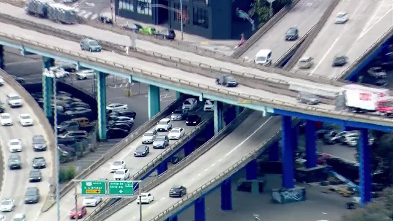 Raw Video: Scene of overturned wood chipper truck on highway transition ramp in San Francisco