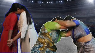 An aggressive wrestling match between two Indian women in saree and salwar ????