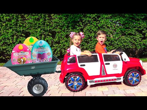 Diana and Roma ride a children's car and find toy surprises