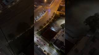 Guy walks on the edge of a building and the cops came