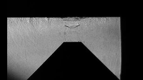 Axially Pulsing Instability in an Underexpanded Impinging Jet