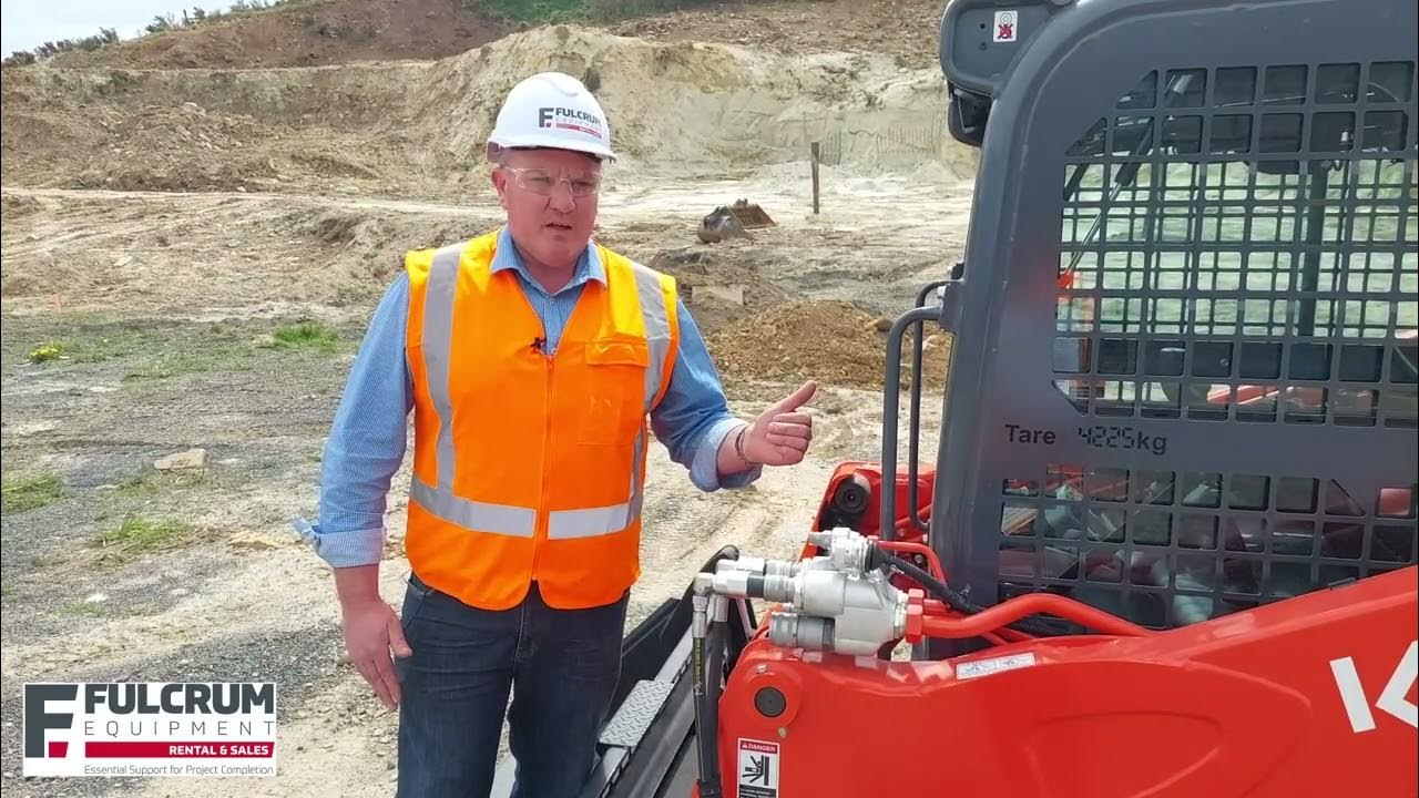 How do I release the quick coupler fittings on my Kubota Skid steer