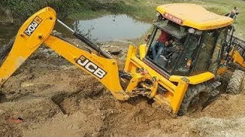 JCB Backhoe Collecting Gravel and Loading in Tractor - JCB Machine Working on Crusher