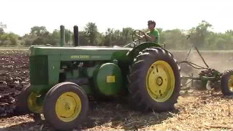 John Deere R Plowing