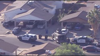 Woman hurt, crews working to contact suspect at Mesa home
