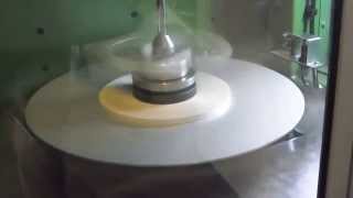 Vertical taping machine for mica glass on big pads