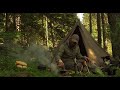 Camping in a lavvu tent among pine trees - coffee in a coconut shell