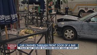 Car crashes through front door of Denver bar