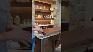 When designing your new basement bar, consider a floating bar top as a distinct feature!