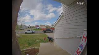 Boy rides ATV in front yard and flips over (Security camera)