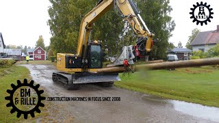 CAT 310 with Grab John bucket on a Rototilt R3 takes down telephone poles