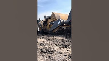 Scraper loading topsoil