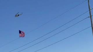 A Helicopter Pilot Flies With a Giant American Flag, USA Convoy