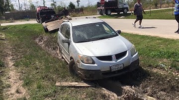Car stuck in a ditch recovery with a winch