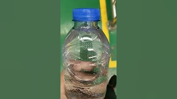 CO2 flying laser marking machine batch date on plastic bottle on conveyor belt production line