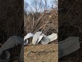 Cleaning up after F2 tornado with excavator