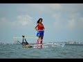 Wonder woman in a clear kayak  canoe with electric motor