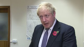 Boris Johnson helps clean up flood water in North and Midlands