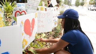 Orlando realty firm honors shooting victims with hundreds of signs