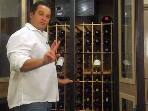 Jake shows the features of the LeCache European Wine Cabinet in the Vintage Cellars showroom