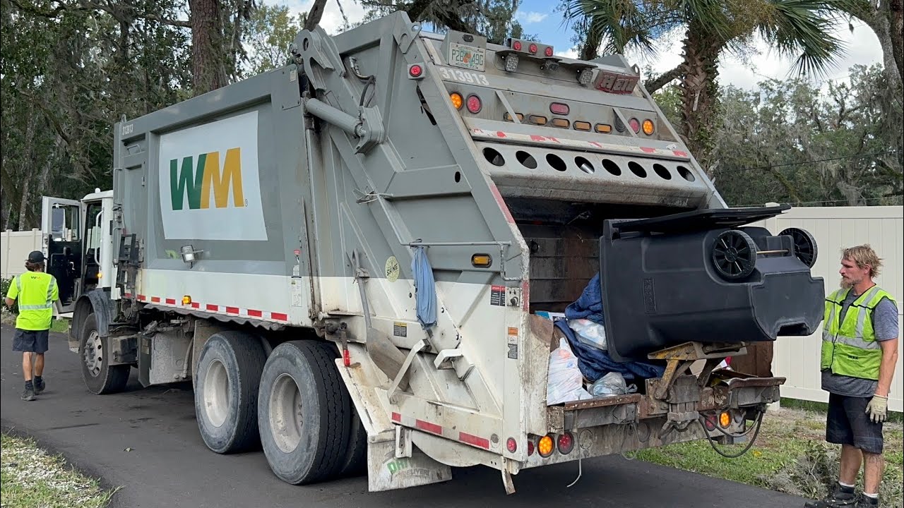 Waste Management Mack MRU Heil Rear Loader Garbage Truck Packing Post Storm Trash by The Coast