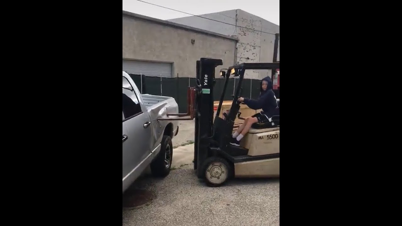 KID DRIVING FORKLIFT TRUCK CRASHES INTO TRUCK YouTube