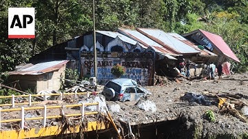 Rescue workers search for survivors in Indonesia after floods and landslides
