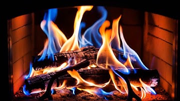 Create A Warm Ambience With Colorful Blue & Orange Flames In A Fireplace Against Brick Walls