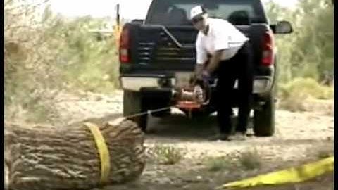 Lewis Winch skids log around a corner using a Lewis Winch snatch block