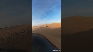 Ford Raptor and Dodge TRX cruising the desert