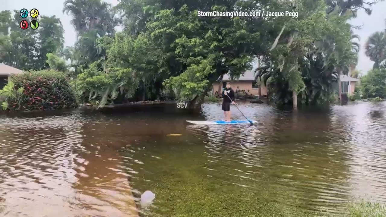 Paddle Board And Tubing Down A Flooded Road, Tropical Storm Debby, Fort Myers, FL