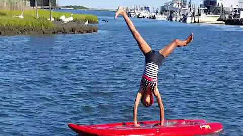 Paddle board gymnastics! Sky is a natural!